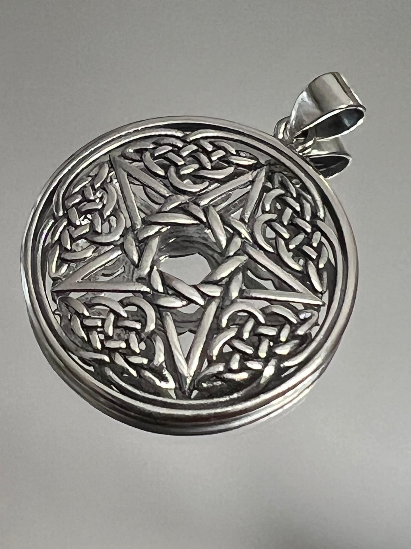 This item is a men's sterling silver Celtic Star Pendant.