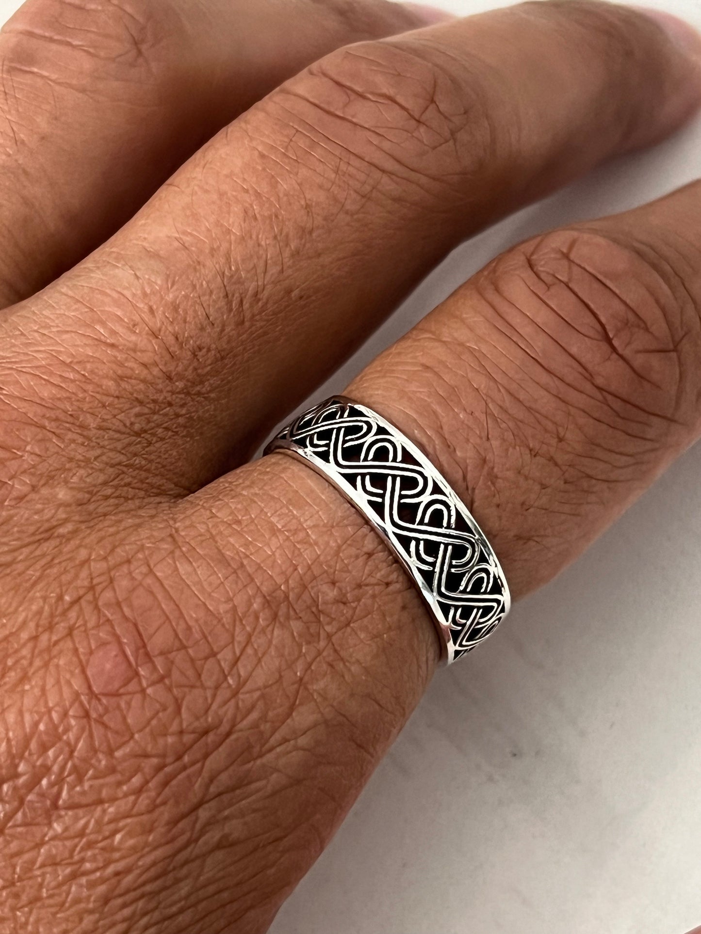 The Celtic Men's Ring is a stunning 7mm sterling silver band, specifically designed for men. This ring makes for an ideal gift.