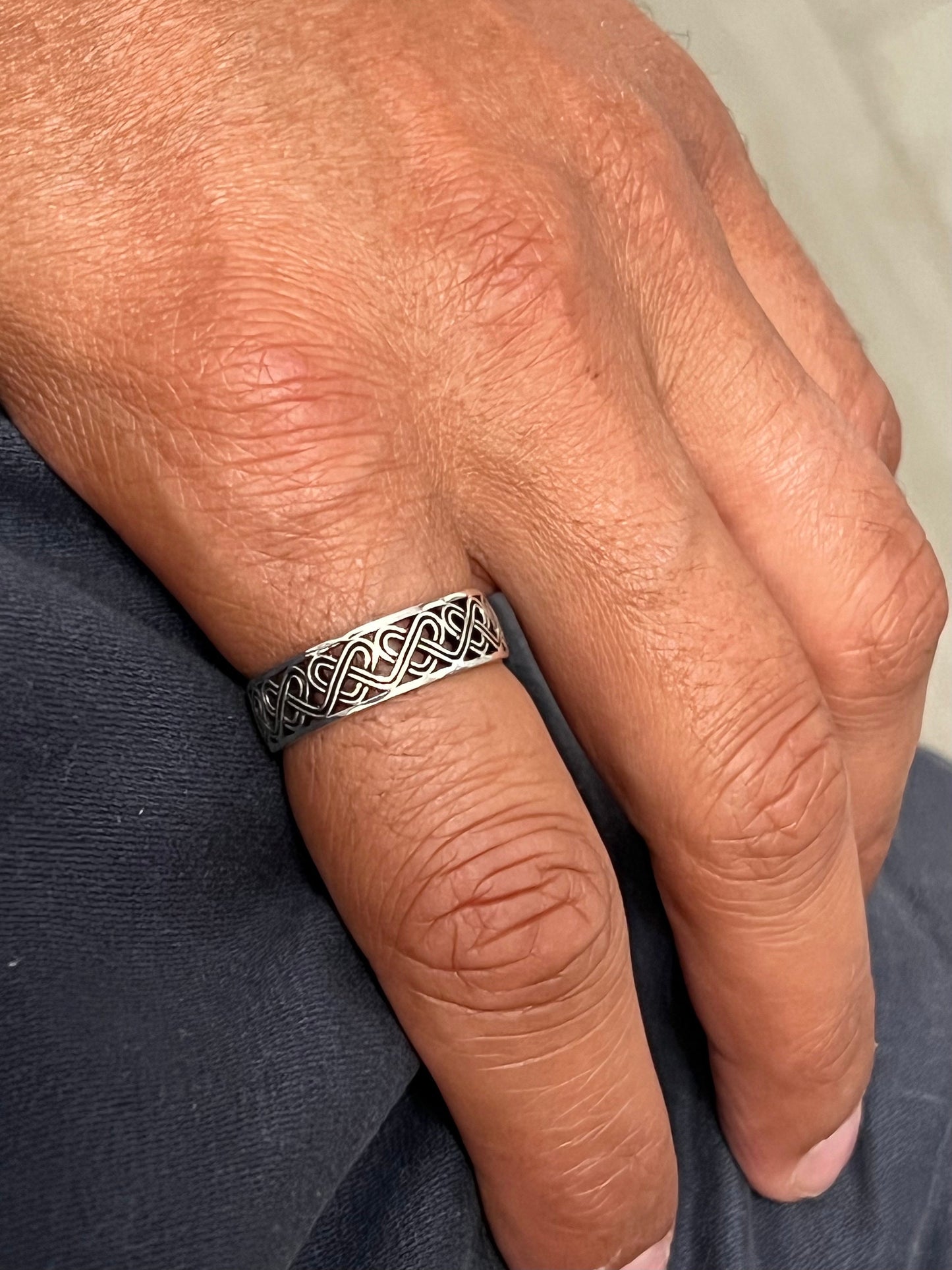 The Celtic Men's Ring is a stunning 7mm sterling silver band, specifically designed for men. This ring makes for an ideal gift.