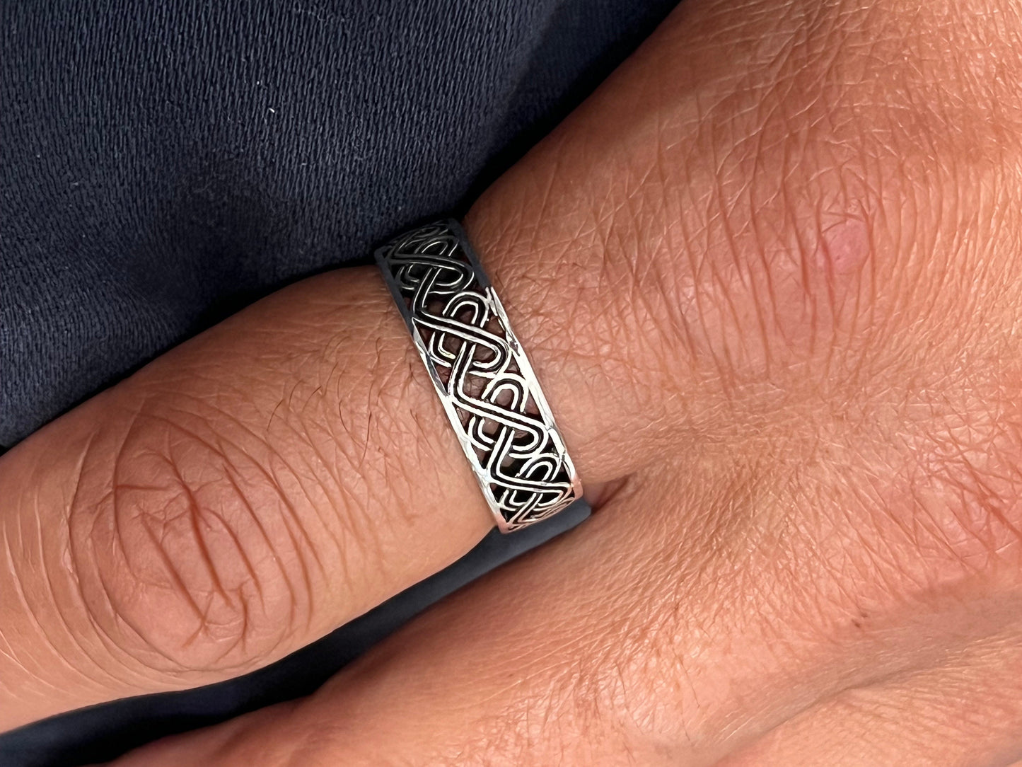 The Celtic Men's Ring is a stunning 7mm sterling silver band, specifically designed for men. This ring makes for an ideal gift.