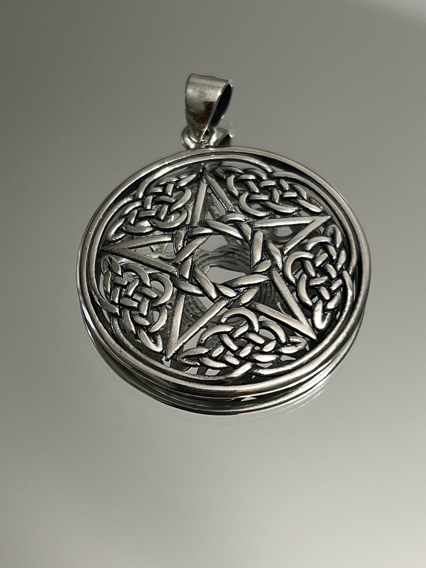 This item is a men's sterling silver Celtic Star Pendant.